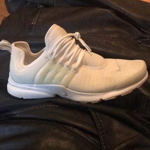 White Nike tennis shoes.